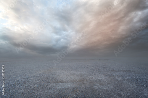 Fantasy gravel background with dramatic sunset sky 