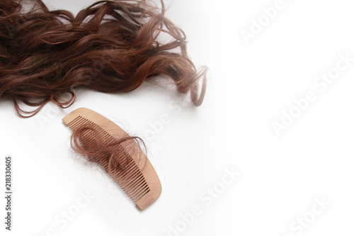 Balding problem women hand holding loss hair comb photo