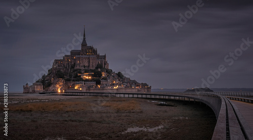 Beautiful night view of famous illuminated historic Le Mont Saint-Michel tidal island, France