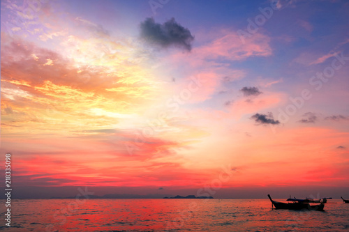 Sightseeing travel concept:Traditional thai boats at sunset beach