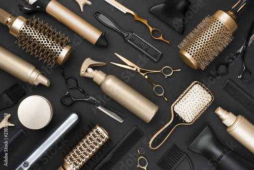 Fototapete Full frame of professional hair dresser tools on black background
