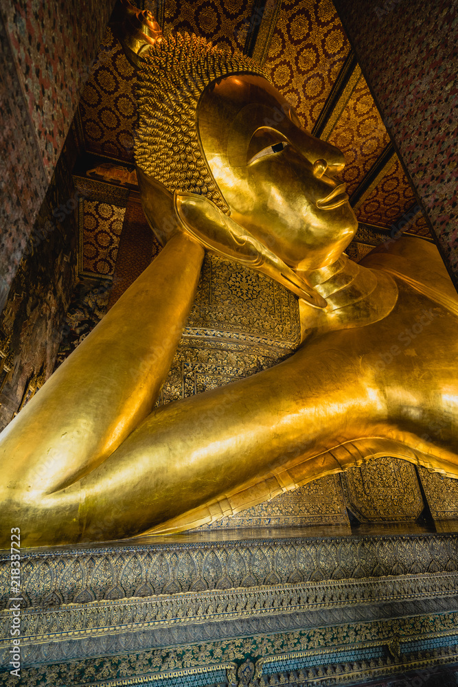 Big Buddha gold statue, Closeup golden buddha, Wat Pho at Bangkok, Thailand.