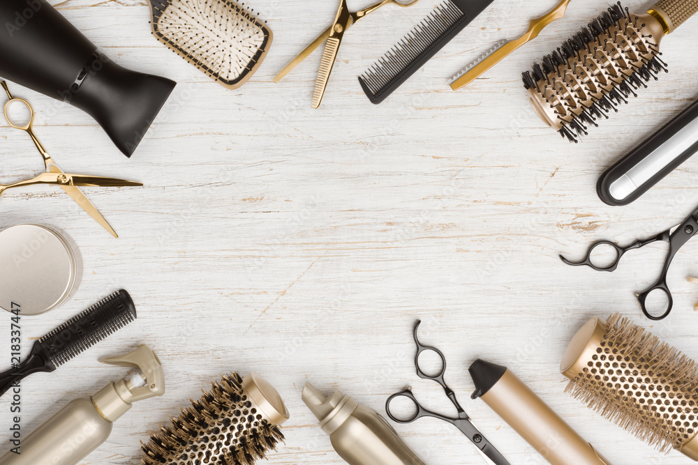 Various hair dresser tools on wooden background with copy space - obrazy, fototapety, plakaty 