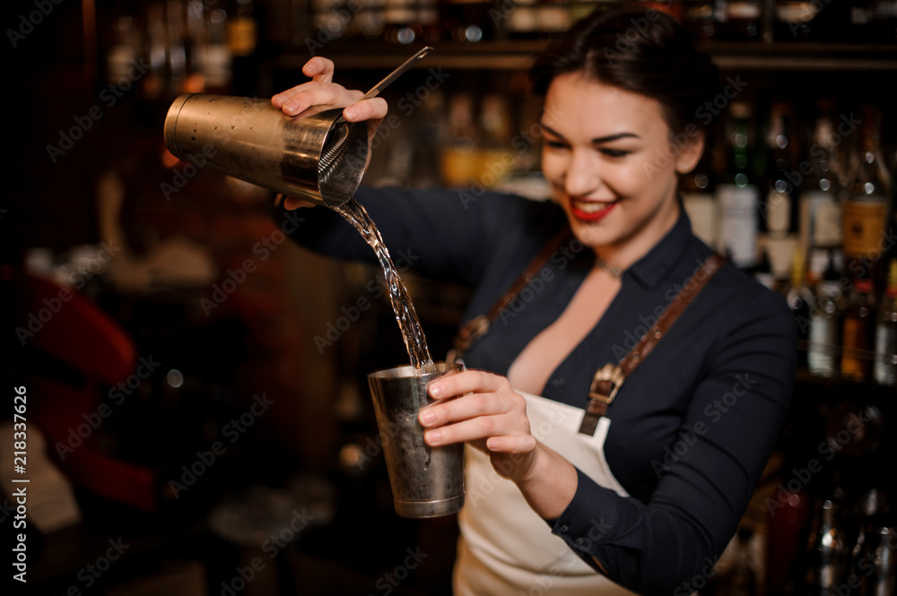 Beautiful sexy smiling barmaid making a fresh summer cocktail Stock Photo |  Adobe Stock