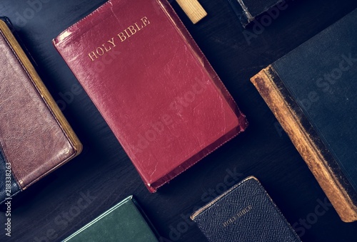 Fototapet Diverse holy bible on black background