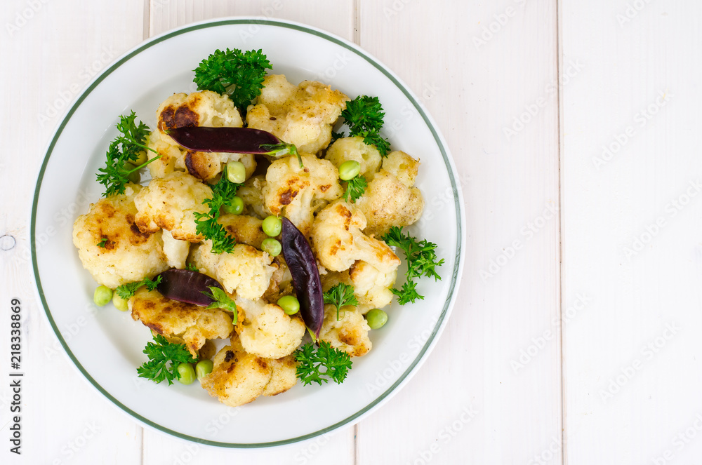 Vegetarian dish with cauliflower and peas Vegetarian dish with cauliflower and peas