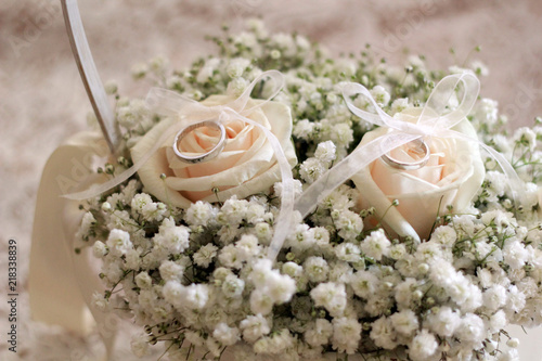 wedding rings on a bouquet of roses