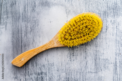 body brush on wooden background photo