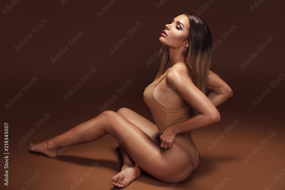 Sensual brunette woman with ideal tan body. Sensual brunette woman with ideal tan body.