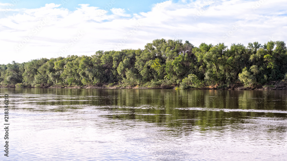 View of the river, wood and sky in the summer evening (1). View of the river, wood and sky in the summer evening (1).