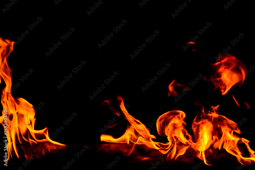 Fototapeta premium Fire flames on black background