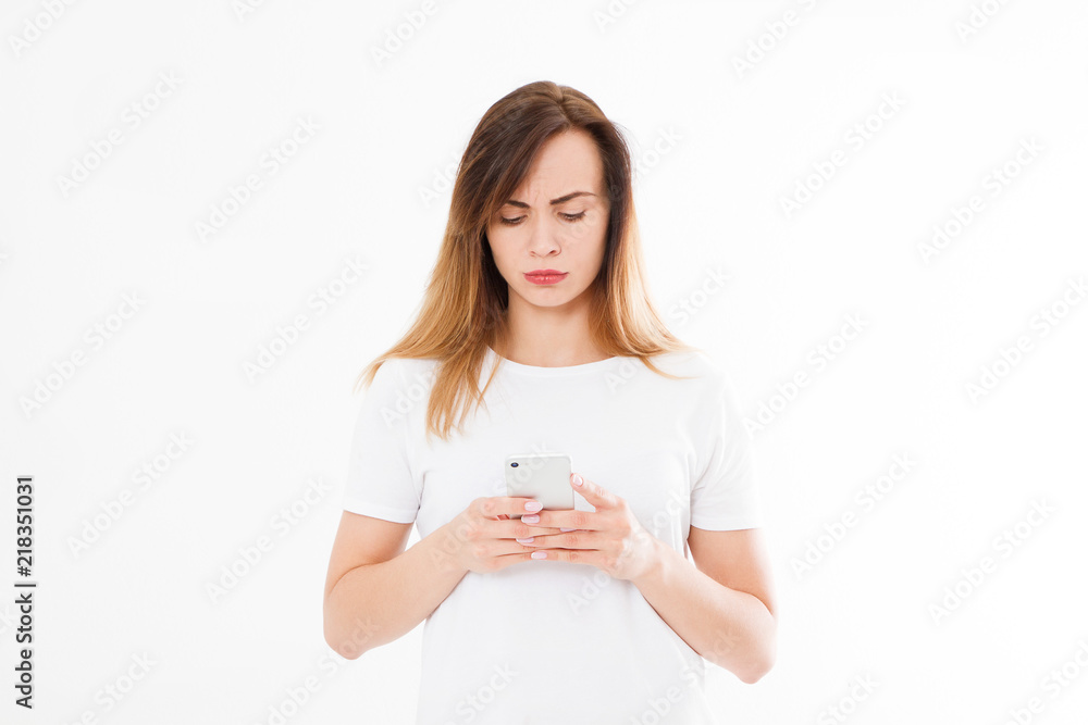 girl used smartphone, cellphone isolated on white background. sad woman holding white phone. Copy space