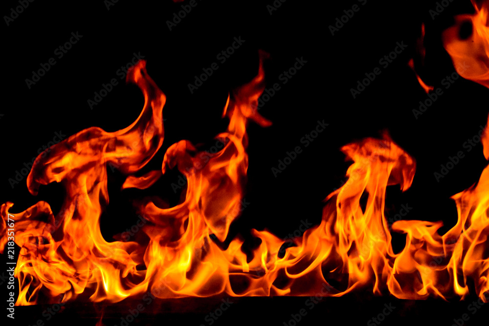 Fototapeta premium Fire flames on black background