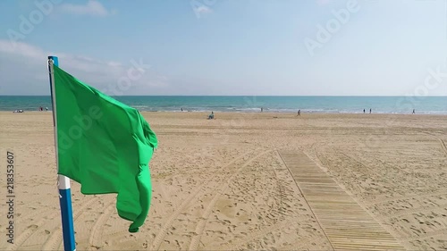 Green flag on the Mediterranean beach