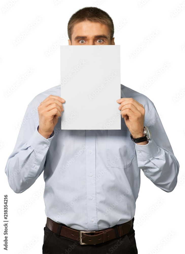 young man holding an empty banner over his face young man holding an empty banner over his face