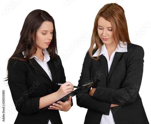 Two Young Businesswomen Working - Isolated