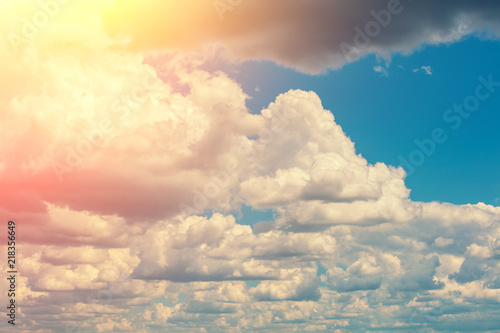 Beautiful cloudy sky background. The sun shines through the clouds © vvvita