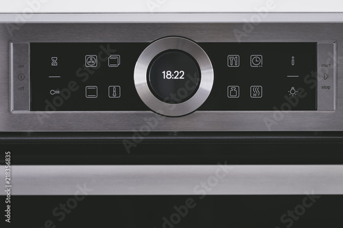 Steel modern touching panel of house electric oven.