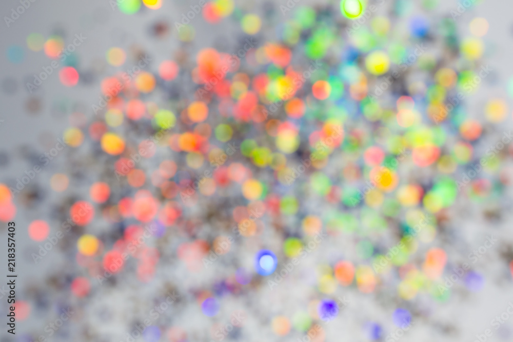 Colorful beautiful blurred bokeh background Holiday texture. Glitter multicolored light spots