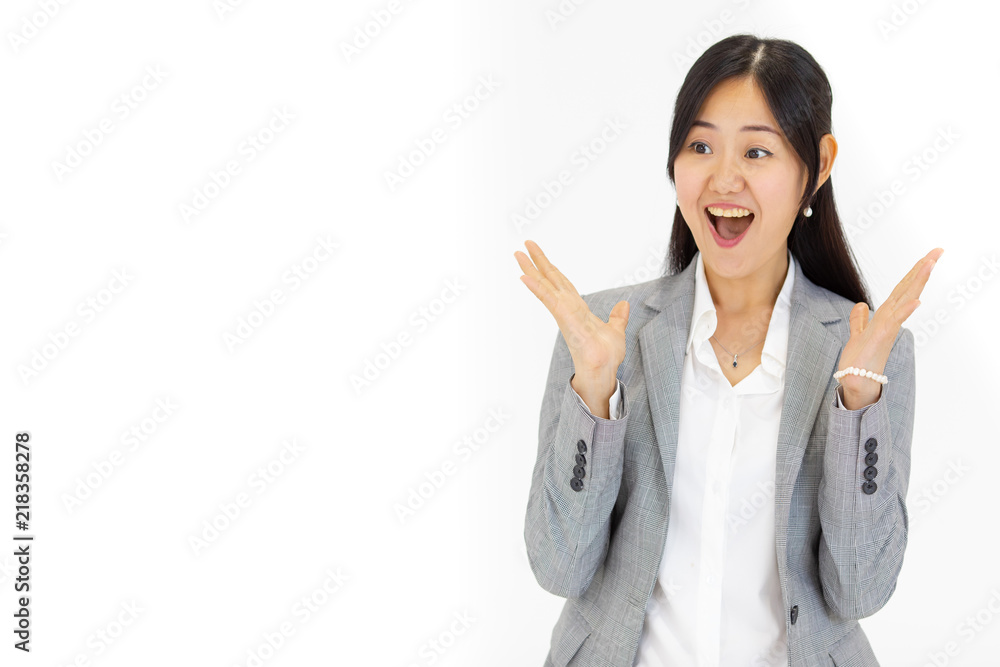Beautiful charming Asian girl with long hair has a nice amazed look in a suit on white background. Beautiful charming Asian girl with long hair has a nice amazed look in a suit on white background.