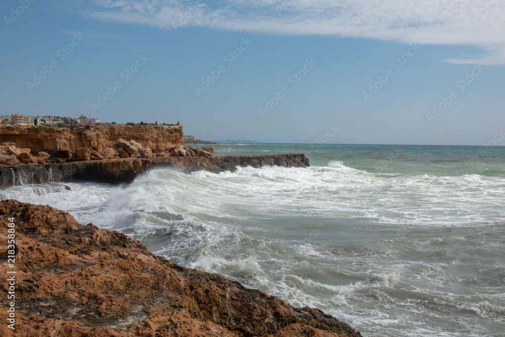 White ocean waves crashing to rocks White ocean waves crashing to rocks