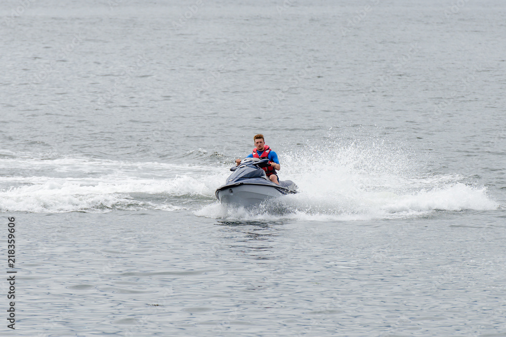 man is riding a hydrocycle