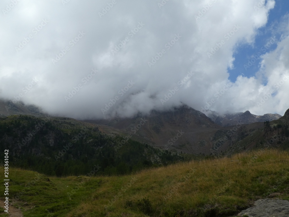 summit rock of the mountains in italy south tyrol europe in the clouds