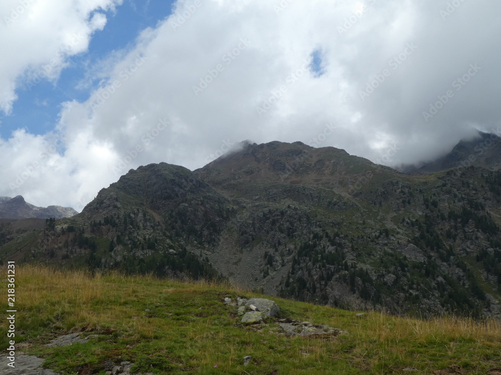 Fototapeta premium summit rock of the mountains in italy south tyrol europe in the clouds