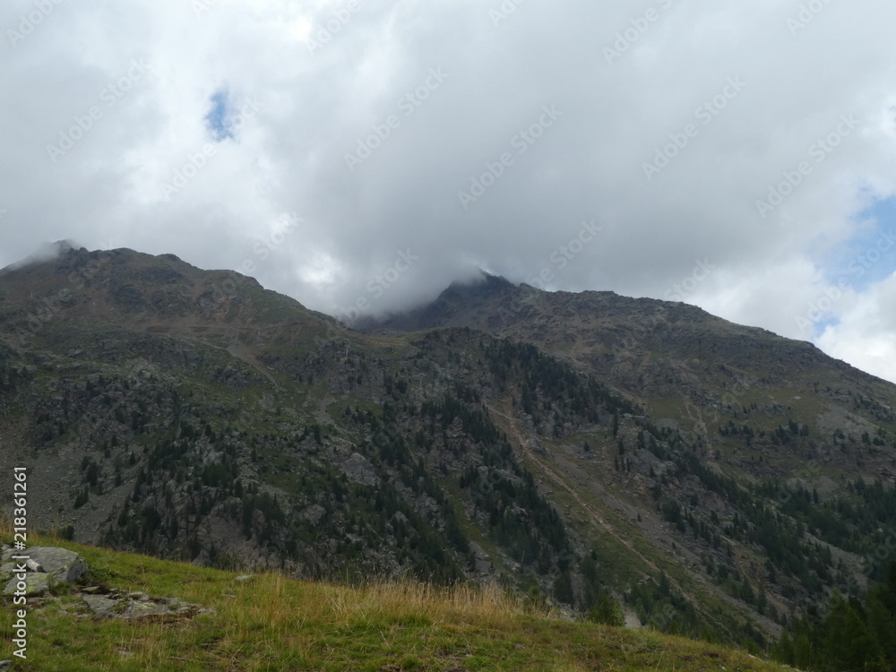 summit rock of the mountains in italy south tyrol europe in the clouds summit rock of the mountains in italy south tyrol europe in the clouds