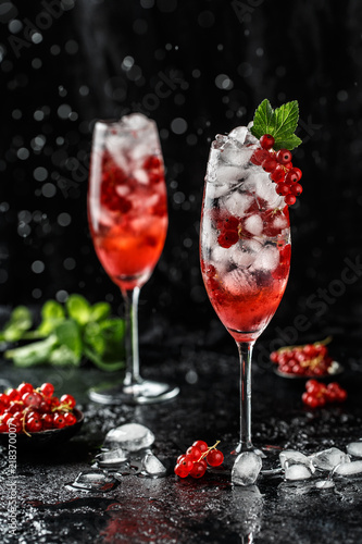 Fresh currant cocktail. Fresh summer cocktail with red currant and ice cubes. Glass of red currant mojito