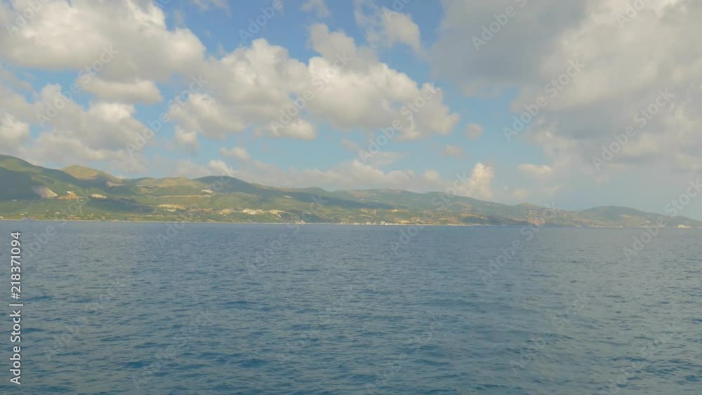 Arriving by boat to an exotic island. Beautiful skies clouds and sea. Arriving by boat to an exotic island. Beautiful skies clouds and sea.