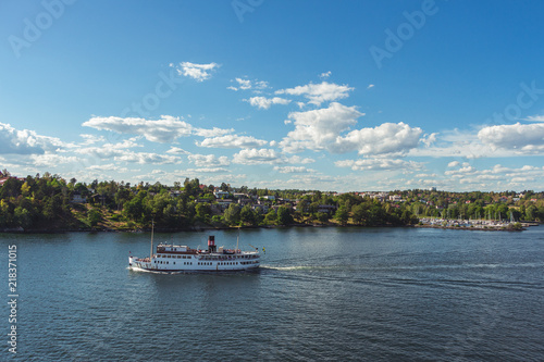 10 July 2018 Stockholm, Sweden: Steamship full of tourists. Popular means to get around. Beautiful views of the Swedish islands on a sunny day.