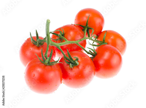 Branch of ripe red tomatoes on white background