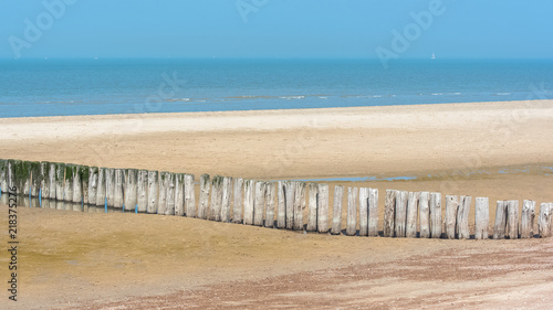 Breakwater on a beach in Holland  low tide  