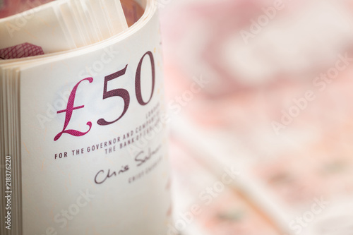 fifty pound notes in UK sterling currency photo