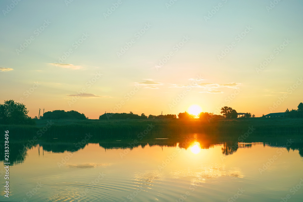 Beautiful summer sunset on small lake