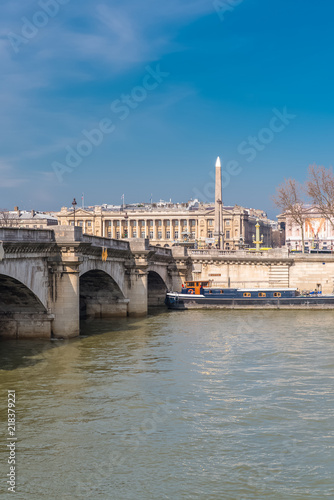 Paris, the Concorde bridge, the obelisk in background, and houseboats on the Seine 