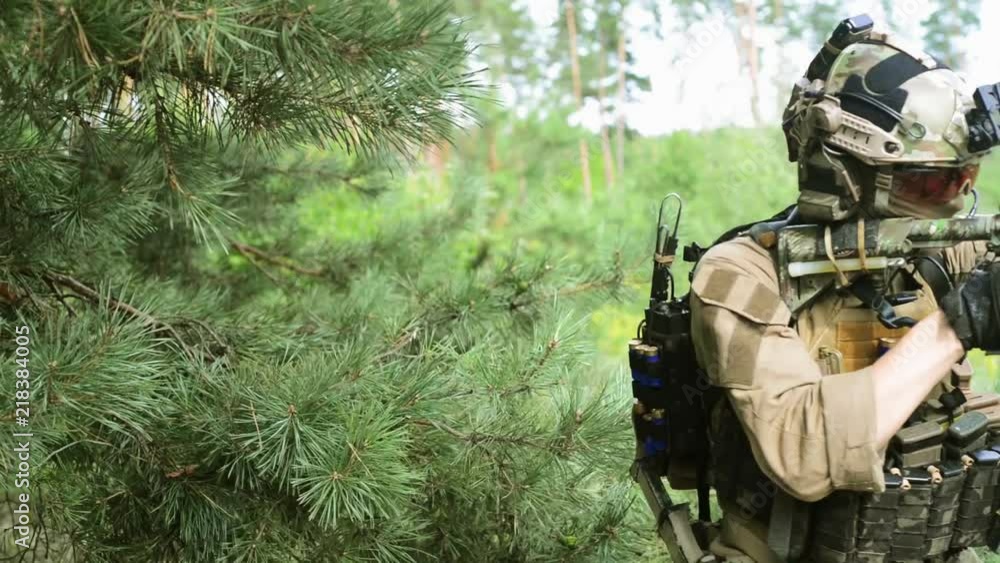 Airsoft man look around in forest and go out Airsoft man look around in forest and go out