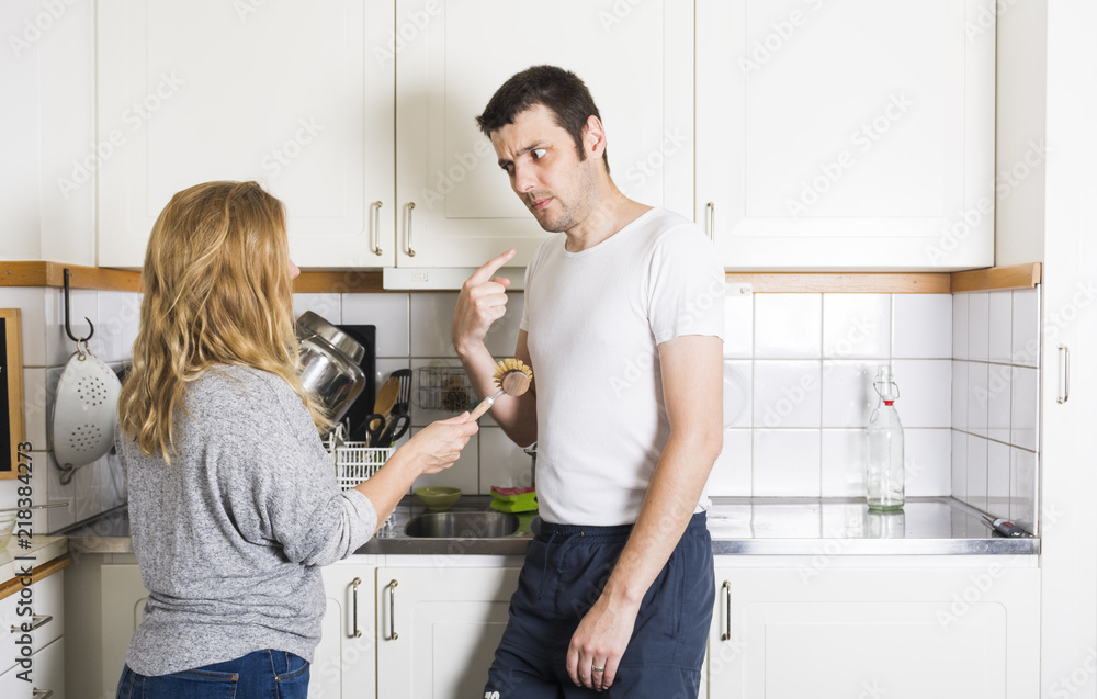 Couple arguing at home about housework Couple arguing at home about housework