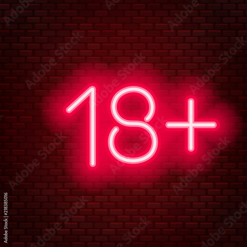Eighteen plus neon sign on brick wall background.