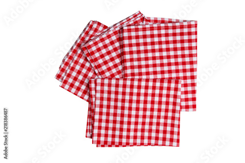 Set of four red and white checkered napkins. Kitchen accessories. © Olga