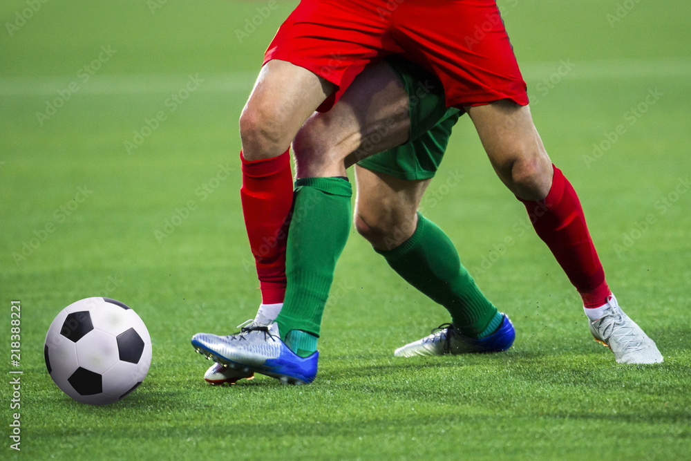 Football soccer match. Soccer player legs in action