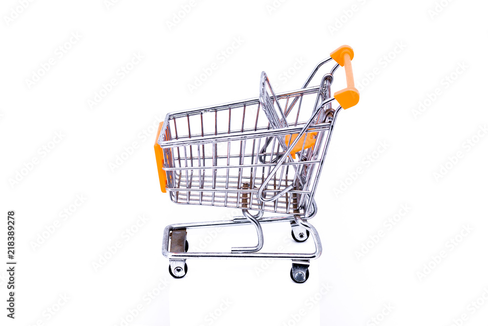 Miniature metal shopping cart with orange elements shot against a white background Miniature metal shopping cart with orange elements shot against a white background
