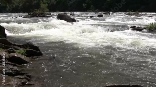 rushing water and distant kayaker