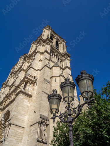 Looking up the exterior facade of Notre Dame de Paris cathedral in Paris France. 