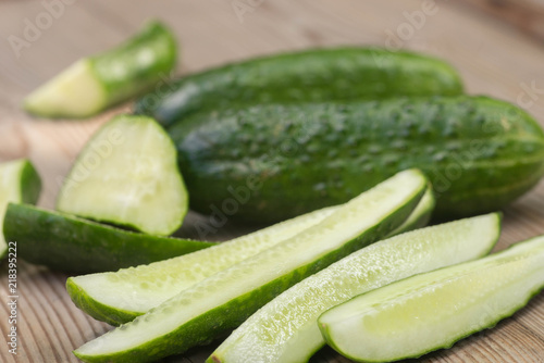 cucumber pieces on wooden board