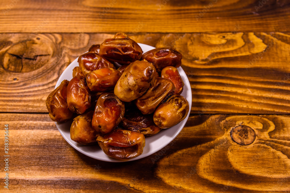 Fototapeta premium Date fruits on the rustic wooden table