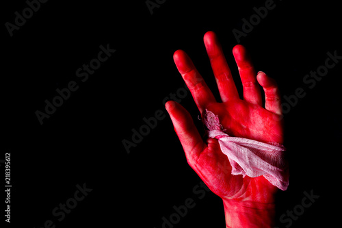 Fotografie Bloody theme lone murderer: the murderer shows bloody hands and experiencing dep