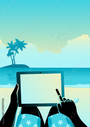 Man using tablet computer on tropical beach