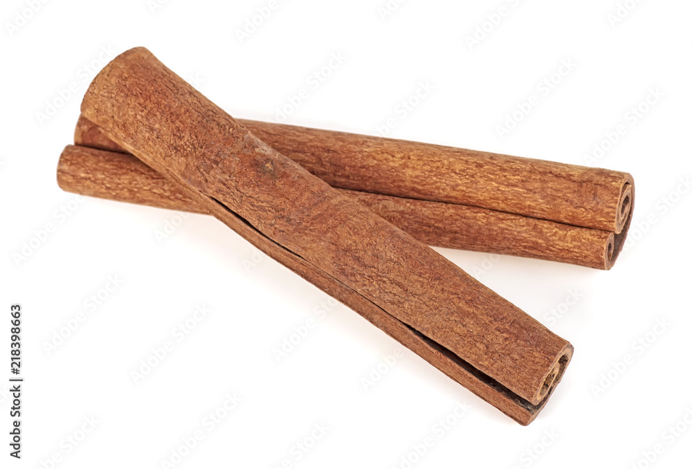 Pair of cinnamon sticks on a white background Pair of cinnamon sticks on a white background